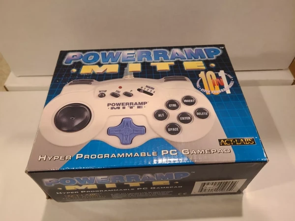 A photo of the box of an old PC gamepad, the Powerramp Mite. It looks vaguely like an old Playstation controller but it has buttons you'd normally see on a PC keyboard - alt, control, delete, enter, space, insert and escape.