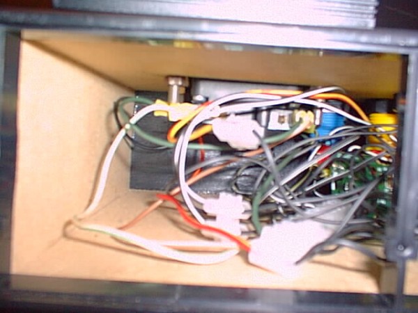 A spaghetti wiring nightmare lurking in a tiny box like a spider shying away from the light