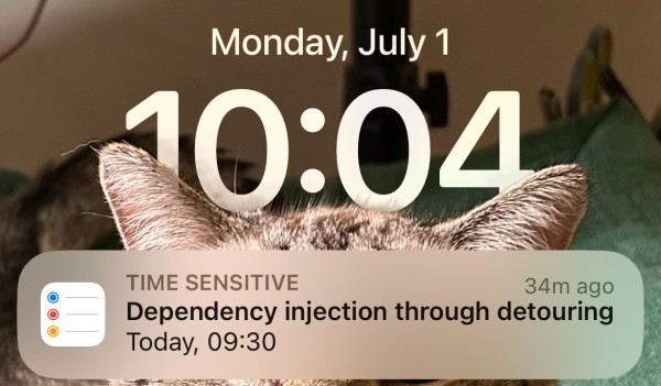 A screenshot of my iPhone showing Monday, July 1 10:04 AM with a reminder saying dependency injection through detouring