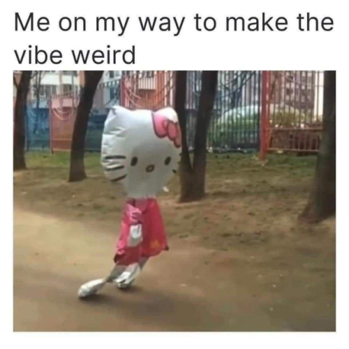 Still image. Hello Kitty balloon with arms and legs, mostly deflated and touching the ground with its swept-back legs, as if struggling to walk or hovering wherever it's going, on a dirt path with a fence in the background painted alternatingly red and blue. 

Top text reads:
Me on my way to make the vibe weird