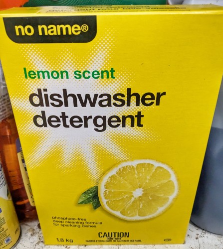 No Name brand lemon scent dishwasher detergent box, bright yellow with a picture of a lemon because of course it has. 