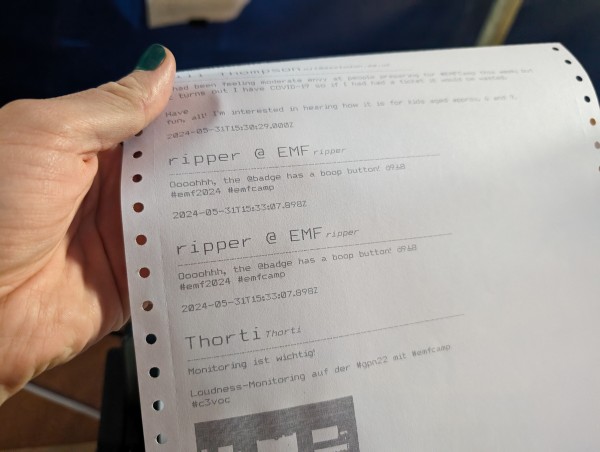 A printout of the toot this one is replying to printed by a dot matrix printer on endless paper. There are other toots before and after it as well, all using the hashtag #emf2024.