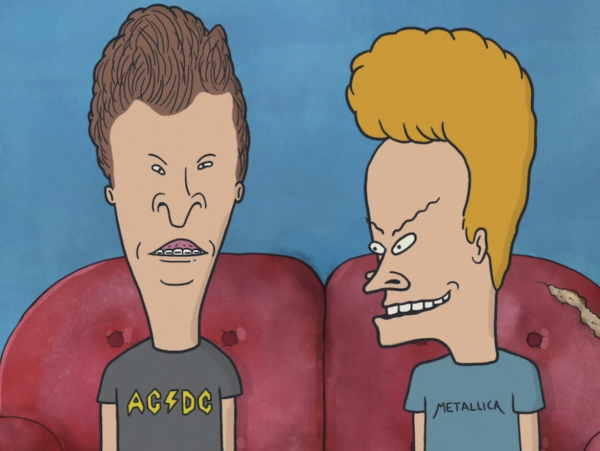 Beavis and Butthead sitting on a red couch.