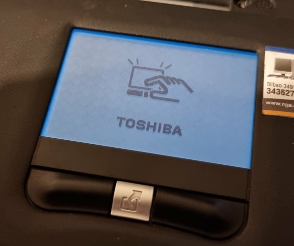 The touchpad displaying the Toshiba logo 