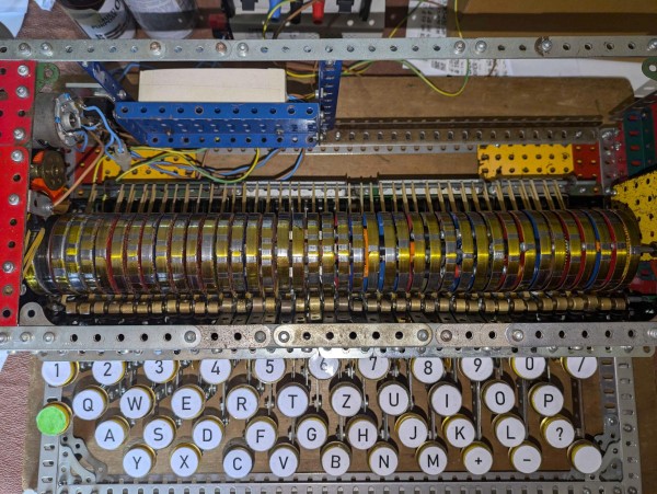 A view looking down into the machine, showing the keyboard at the front, the moving wiper contacts, and the character drum.