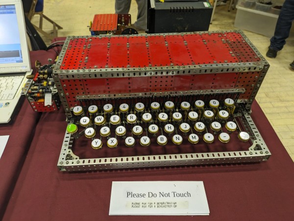 The Meccano Hellschreiber machine - a large red cuboid with an alphanumeric keyboard projecting from the front like a mechanical typewriter.