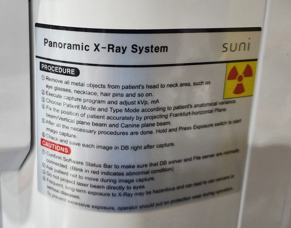 The label on a Panoramic X-ray System. It features the nuclear trifoil 