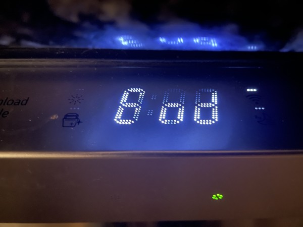Dark dishwasher control panel showing a 7-segment display saying “End”. The segments are pixelated though