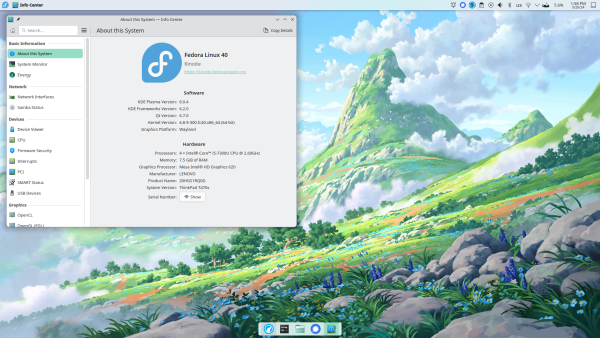 My Laptop running KDE Plasma (a screenshot, not a picture)

It is showing system information, the fact that I'm running Fedora Linux, and there is a wallpaper consisting of a vast landscape with mountains, bushes, trees, grass and clouds, in a digital painting-esque style