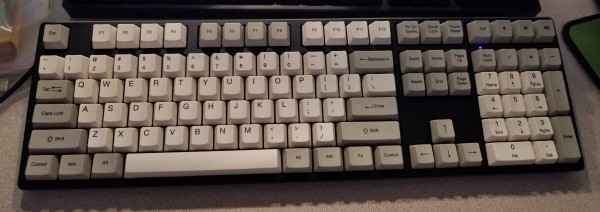 A full profile keyboard. The letters, numbers, and F-keys are beige, and the modifiers and special keys are light grey